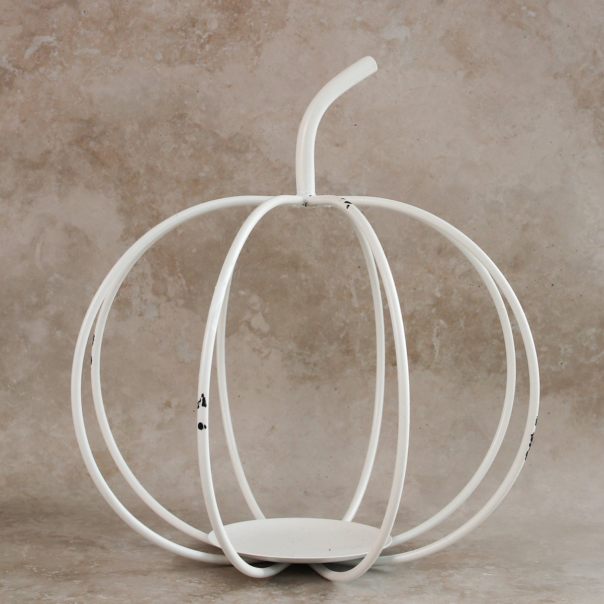 Elegant White Metal Cage Pumpkin showcasing its sturdy design and candlelit ambiance.