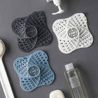 Spiral Drain Cover Hair Catcher in Flexible TPR Rubber with a Built In Handle and Suction Cups