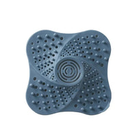 Spiral Drain Cover Hair Catcher in Flexible TPR Rubber with a Built In Handle and Suction Cups