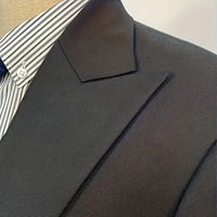 Sophisticated men's formal wear: a slim fit double-breasted 3-piece suit with a sharp waistcoat.